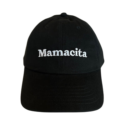 front view of a black hat with the phrase Mamacita in white lettering
