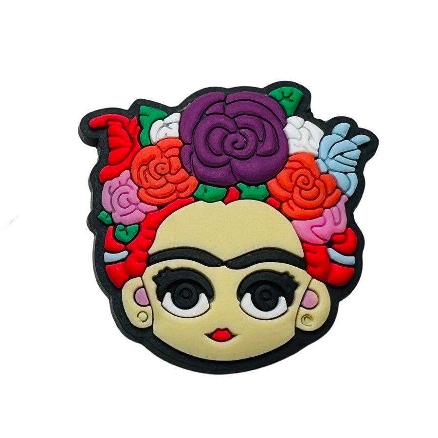 Frida chancla, or croc, charm featuring multi-colored flowers on her head.