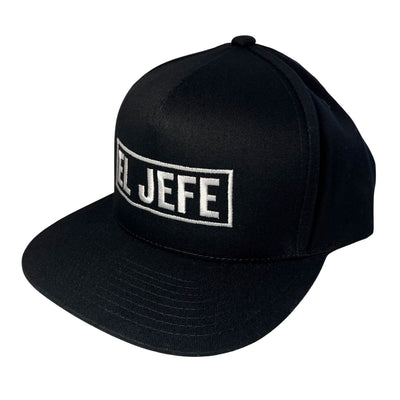 Side view of black snapback hat with the phrase El Jefe in white lettering