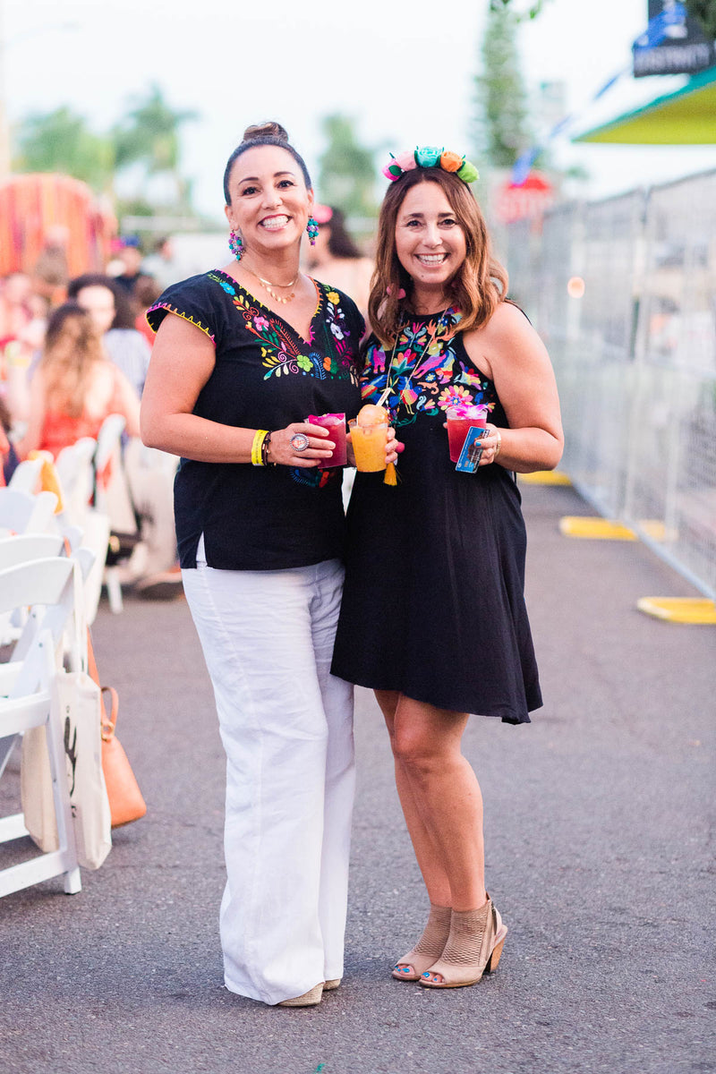 2 women posing for a photo at Artelexia's Fiesta De Frida