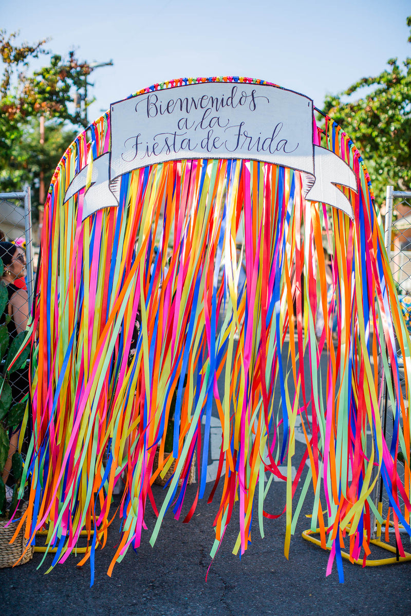 Photo of entrance to Artelexia's Fiesta De Frida. Entrance has a sign that reads "Bienvenidos a la Fiesta de Frida"