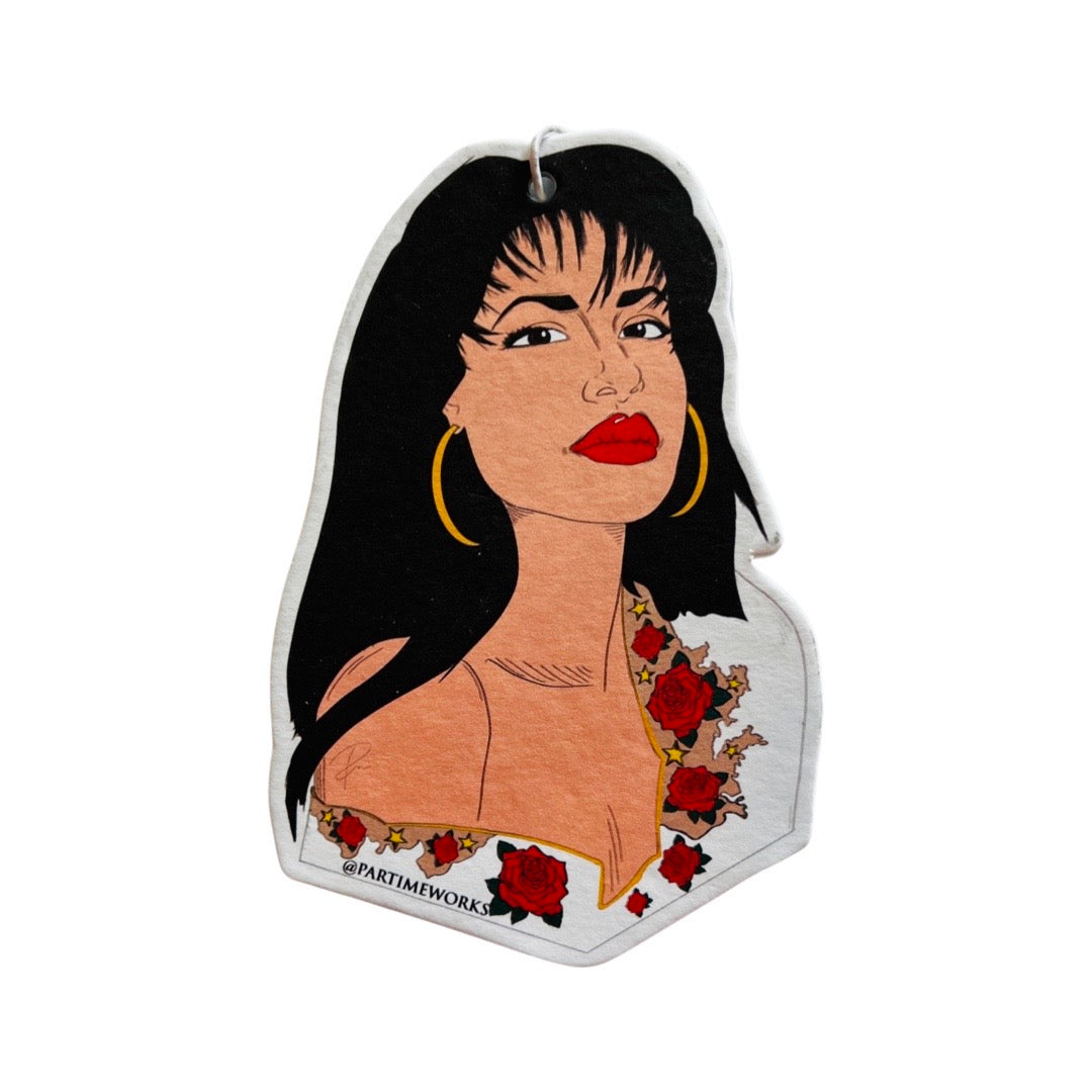 image of Selena wearing a white blouse ad red roses.