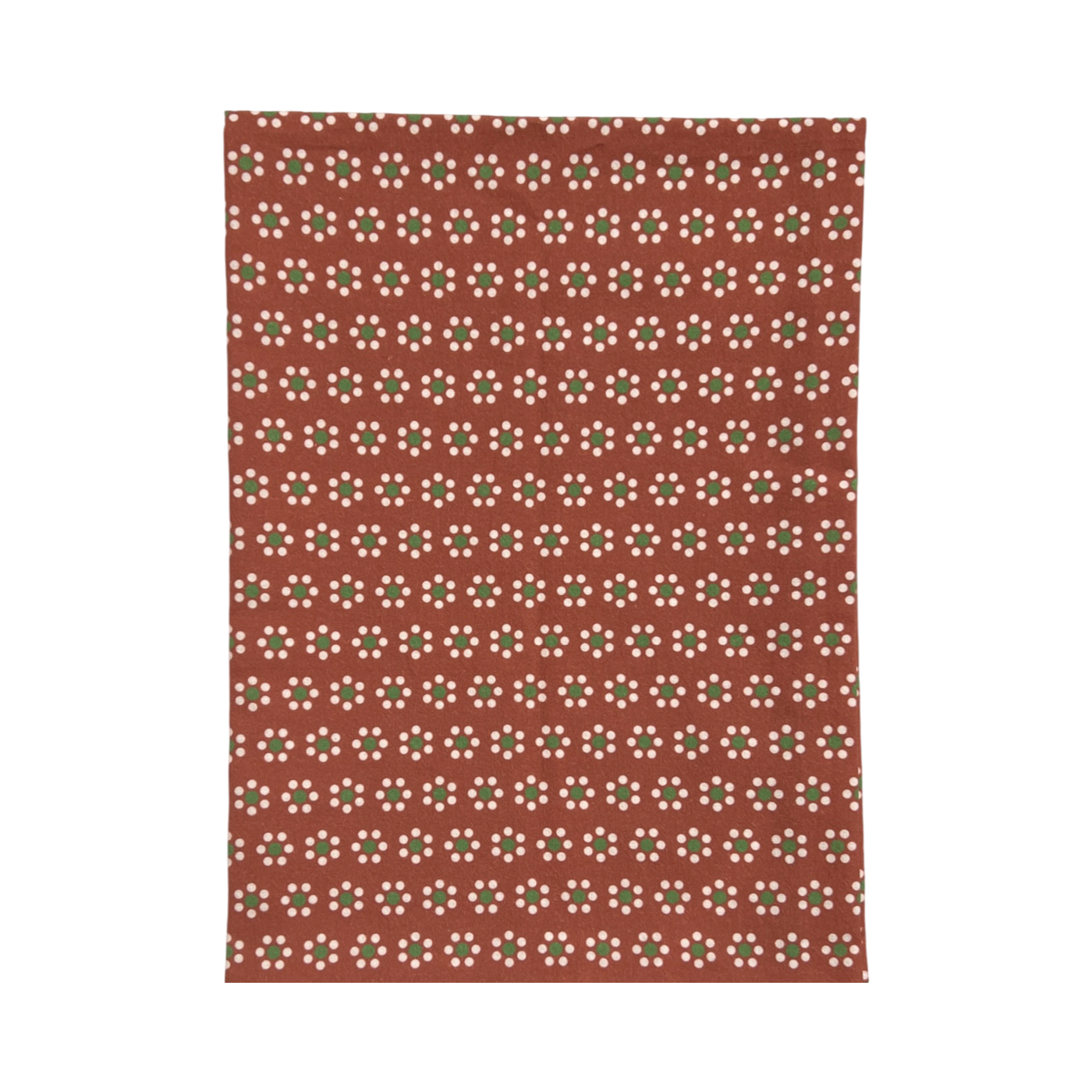 A terracotta-colored kitchen towel featuring a repeating floral pattern inspired by traditional Mexican barro pottery. The design includes small white and green flowers and is folded in quarters.