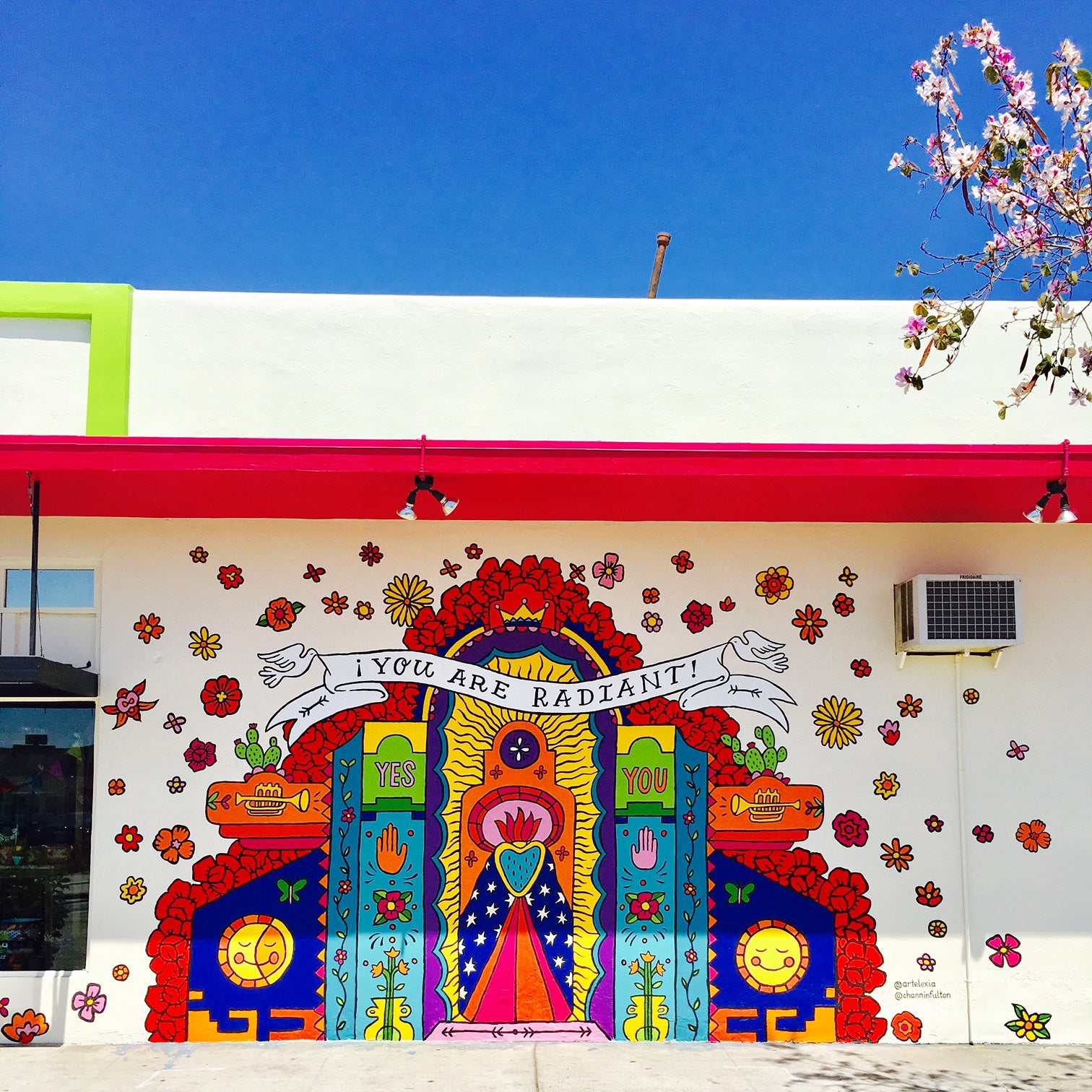 Full view of colorful Artelexia, "You are radiant!" mural. 