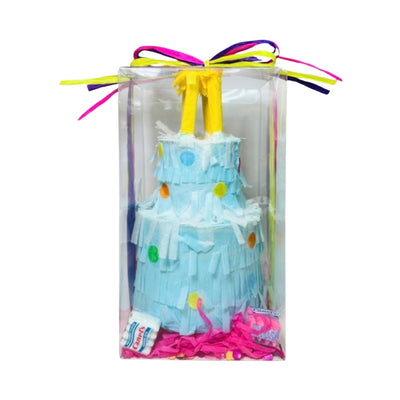 clear plastic box with a blue two tie birthday cake piñata  with yellow candles and features colorful ribbon.