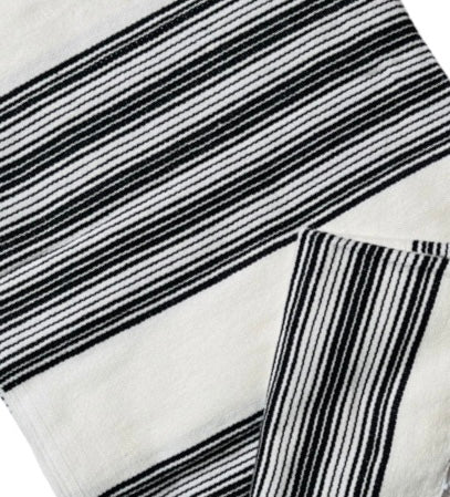 Black and Cream striped color Mexican woven blanket folded in quarters
