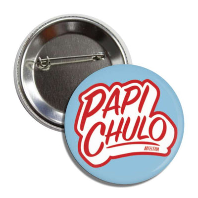 Set of pin-back buttons with one showing the back of it and the other one is light blue with the phrase Papi Chulo in red and white lettering.
