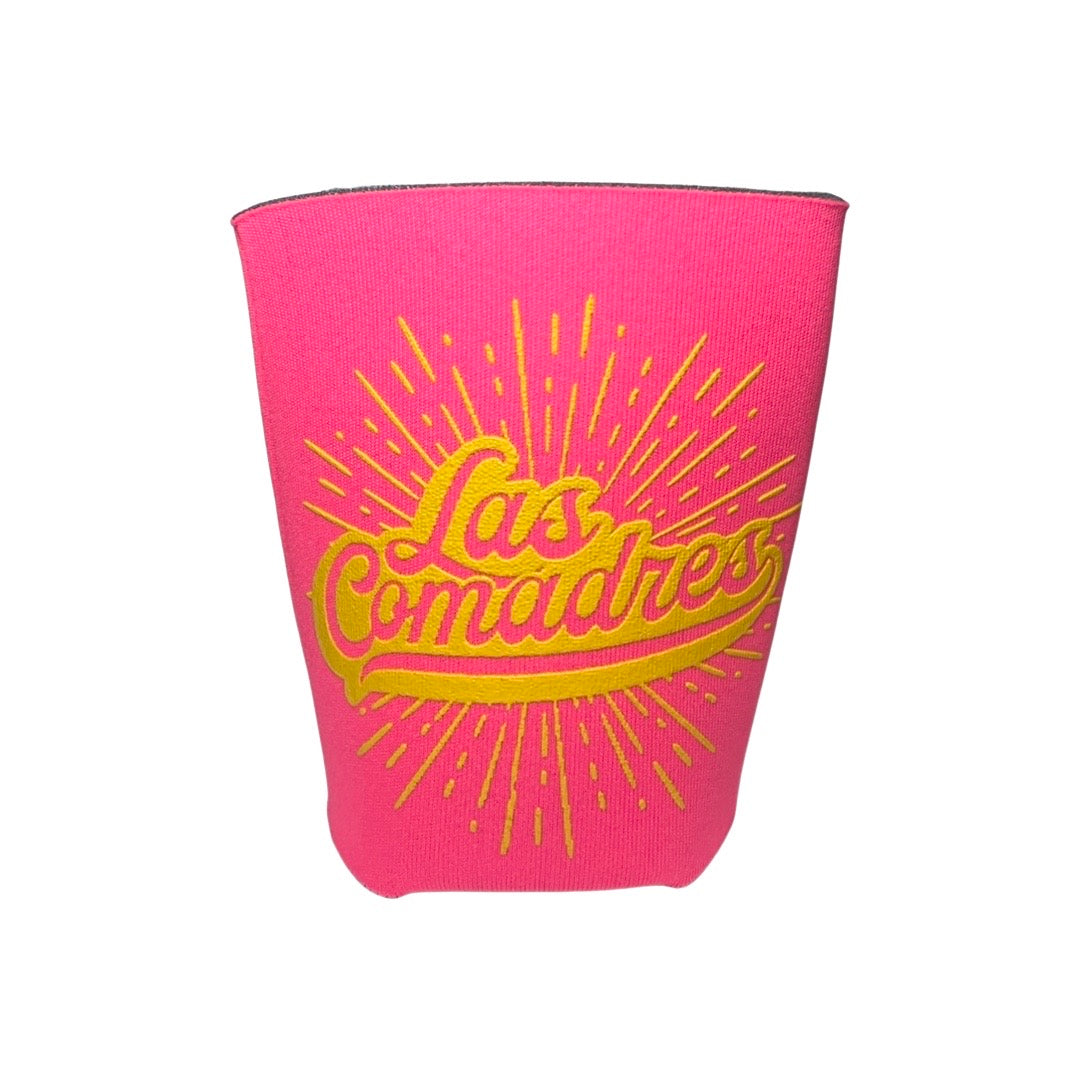 bright pink can cooler with the phrase Las Comadres in yellow lettering.