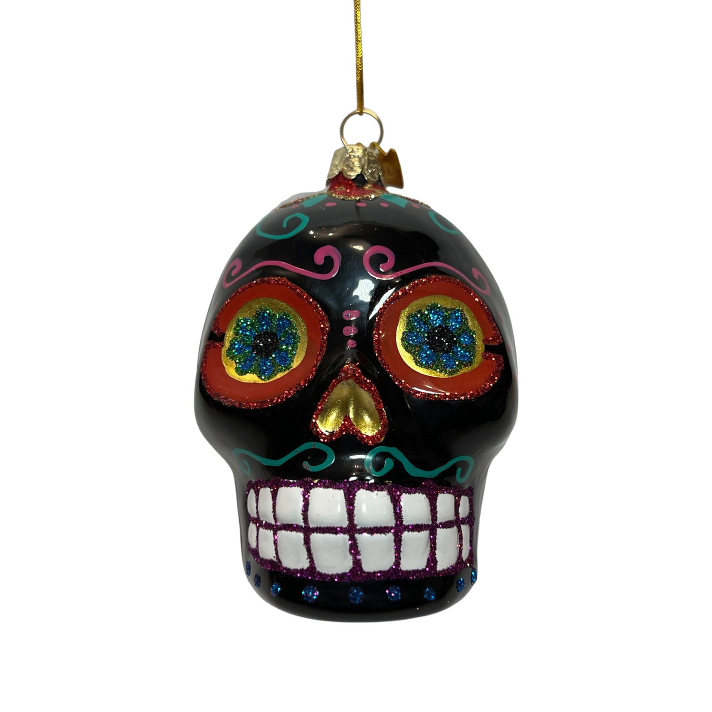 A vibrant black glass ornament in the shape of a Día de los Muertos sugar skull, featuring intricate glitter designs, colorful floral eye accents, and a cheerful, toothy grin.