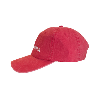 side view of a red hat with the word mamacita in white lettering
