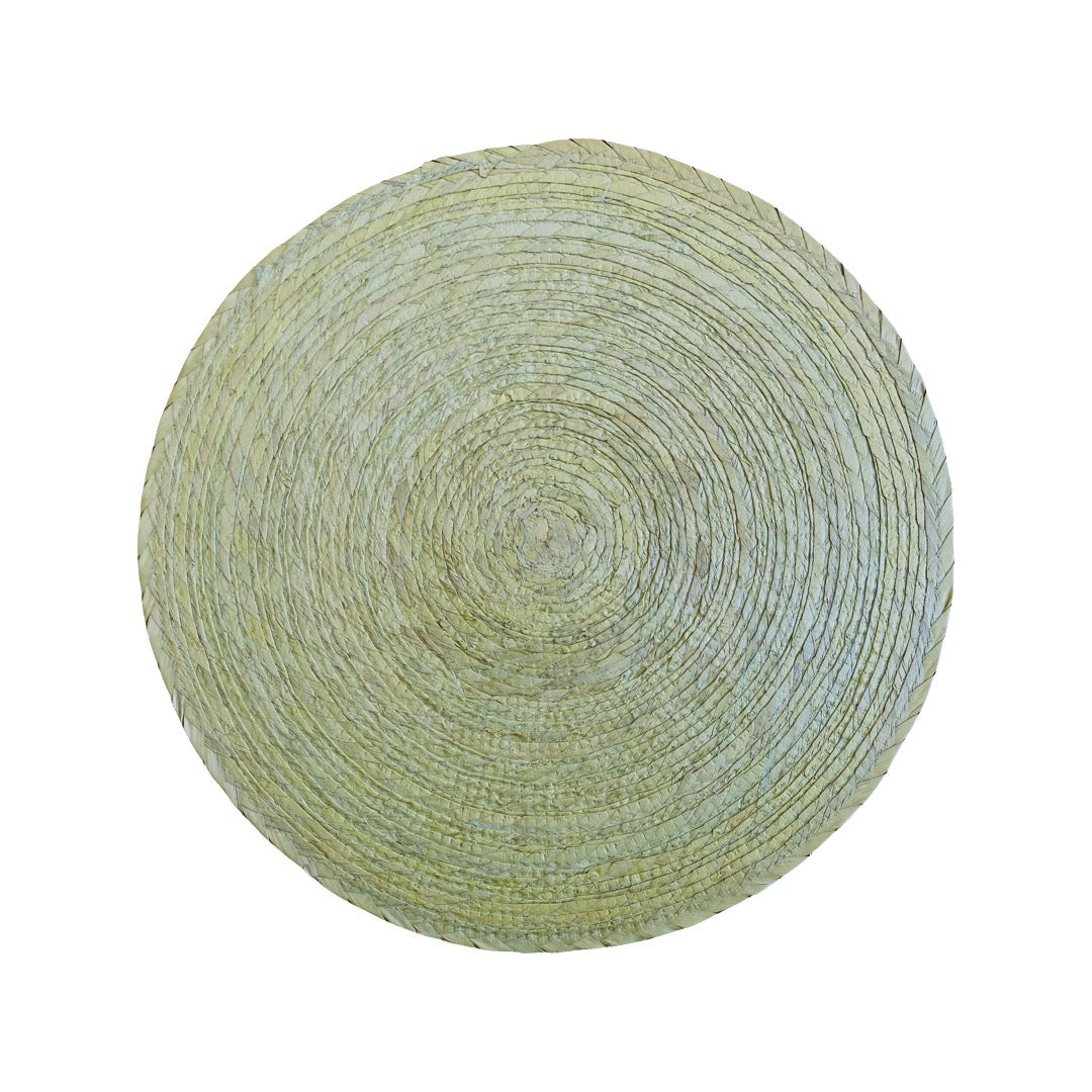 Round woven mat with a textured pattern
