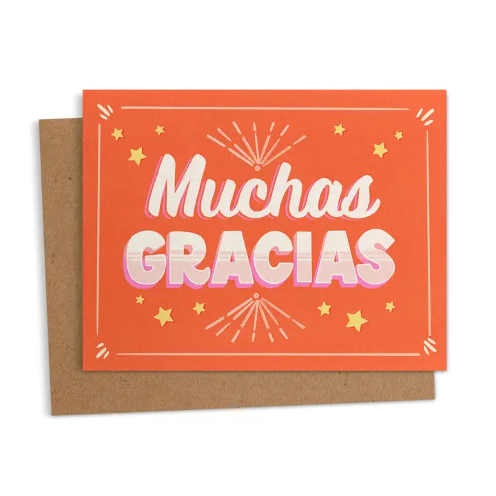 Orange greeting card with the words “Muchas Gracias” in bold white and pink letters, surrounded by stars and decorative bursts.