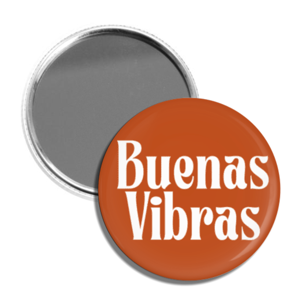 circular pocket mirror with phrase "Buenas Vibras" on the backside