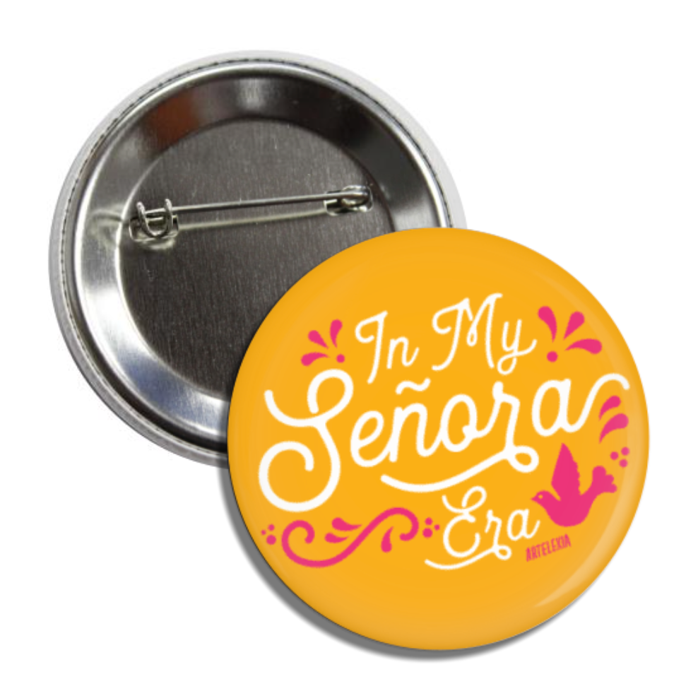 Round pin back button with an yellow background with the phrase In My Senora Era in white lettering