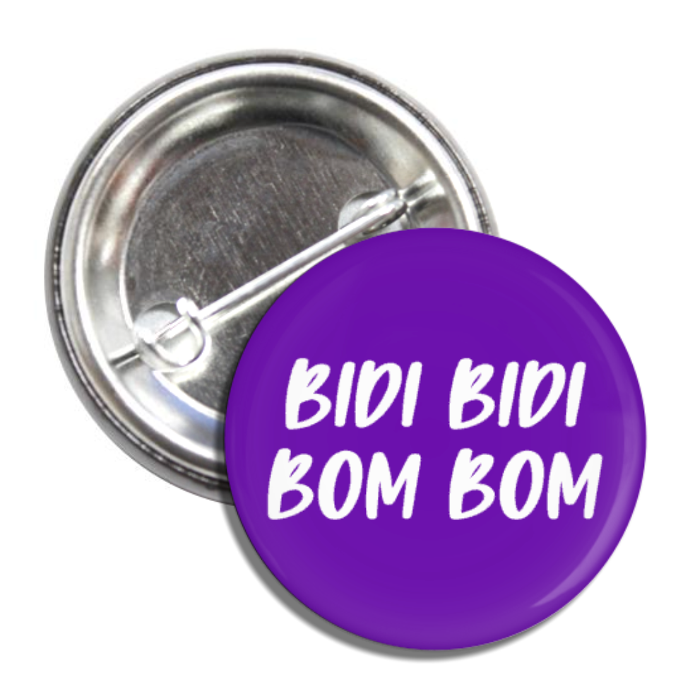 Purple round pin button with the phrase Bidi Bidi Bom Bom in white lettering