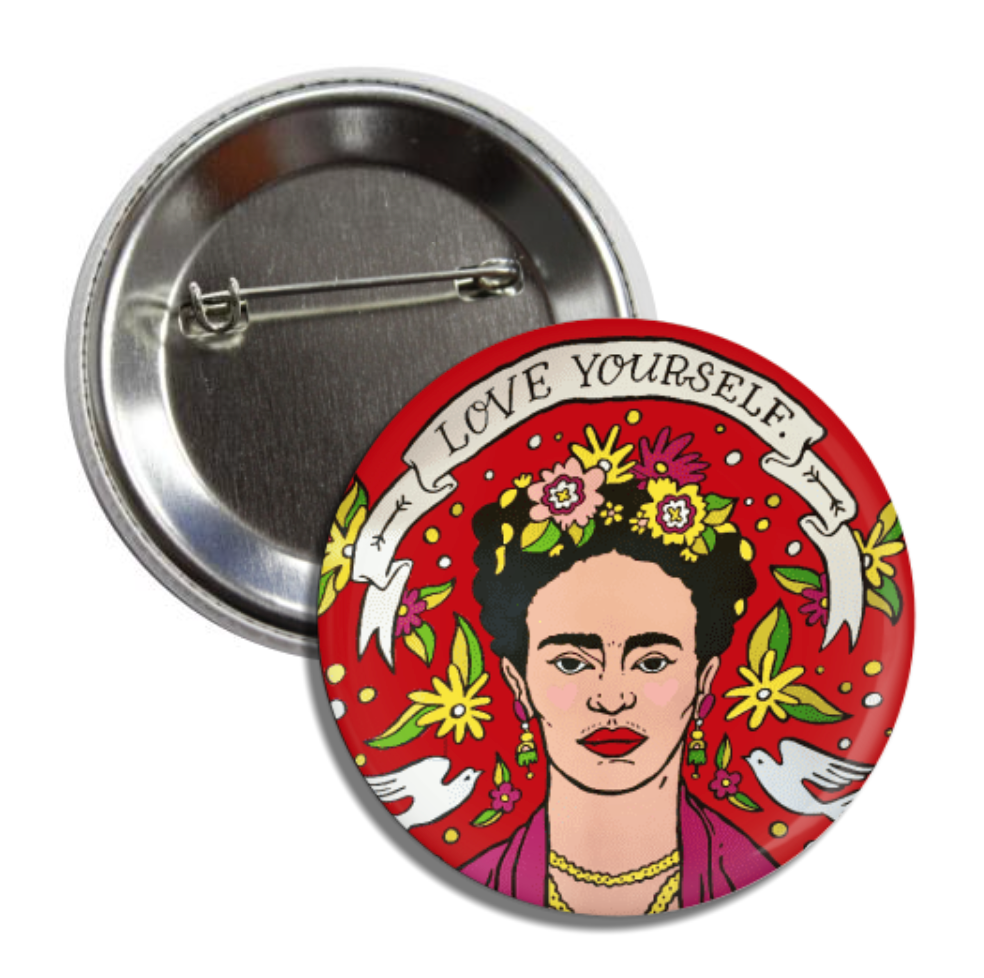 Round pin button with an image of Frida Kahlo and features a banner on the top with the pjrase Love Yourself