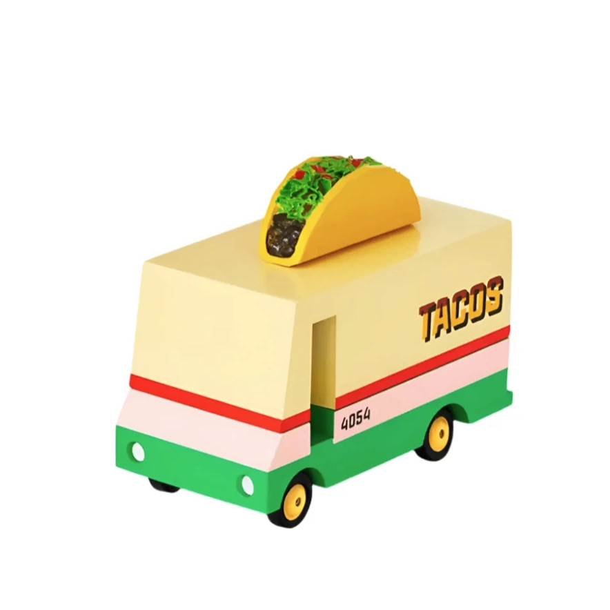 Wooden toy taco truck with a yellow taco on the roof and colorful red, pink, and green accents.