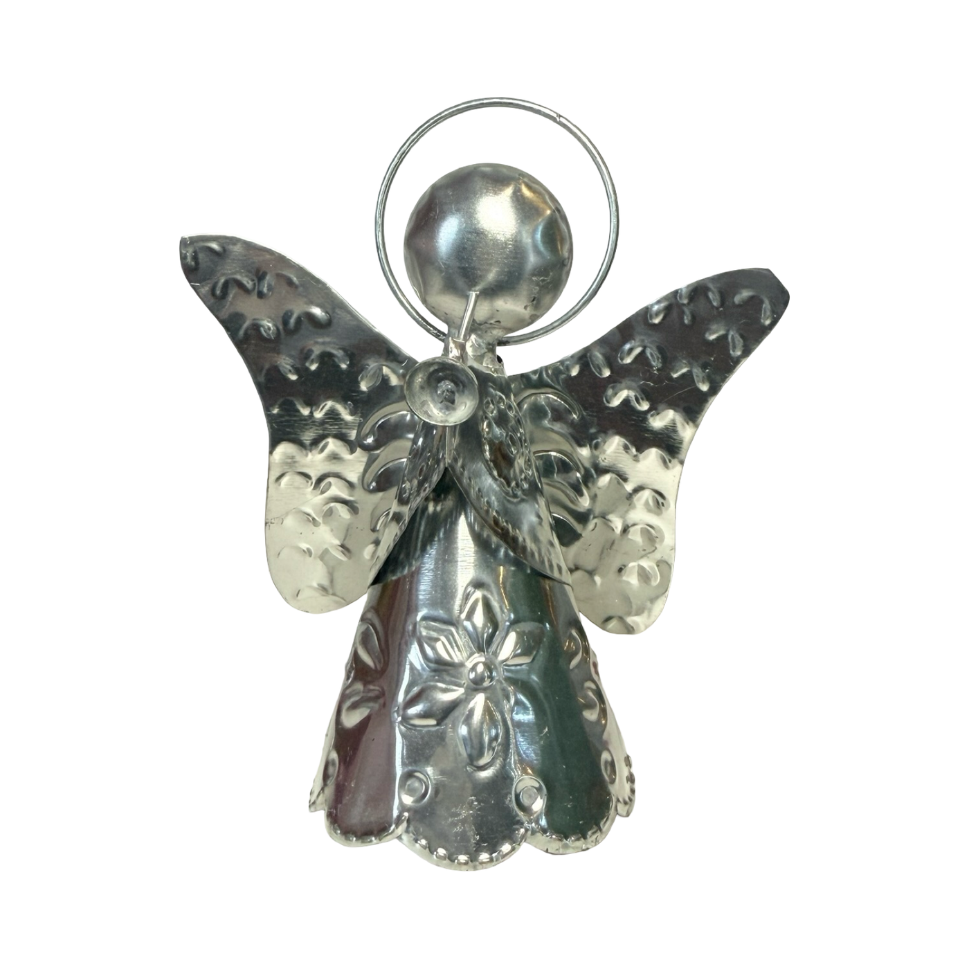 tin shaped angel holding a trumpet.