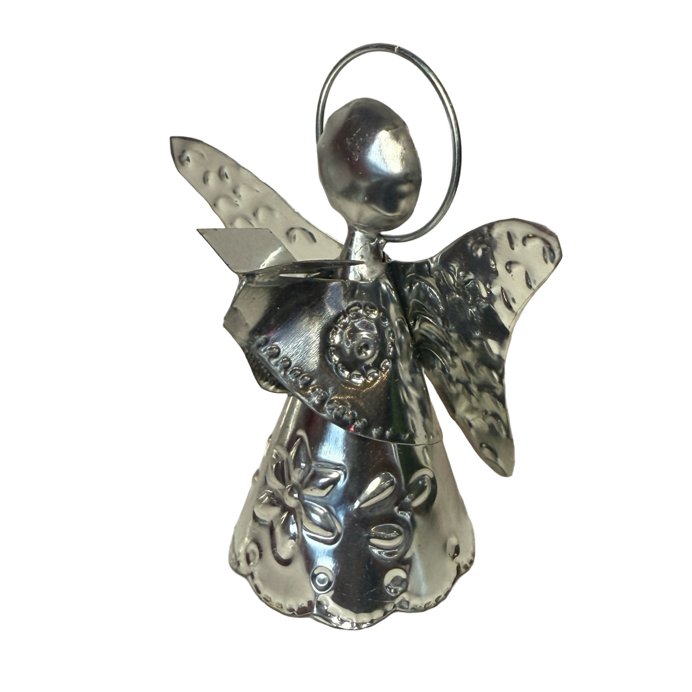 tin shaped angel holding a book.