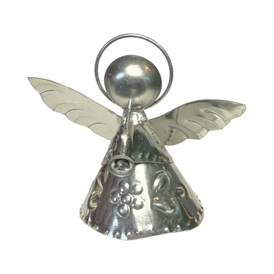 tin shaped angel holding a trumpet
