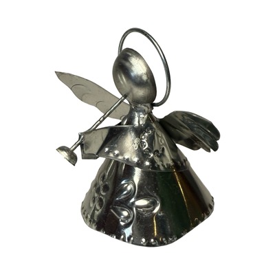 tin shaped angel holding trumpet