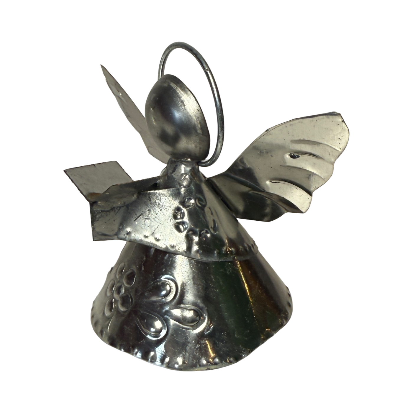 tin shaped angel holding a book.