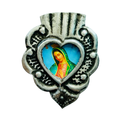 Silver heart-shaped pendant with detailed silver border and central image of the Virgin Mary.