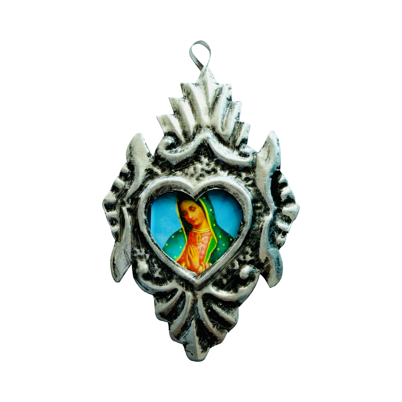 Silver heart-shaped pendant with detailed silver border and central image of the Virgin Mary.