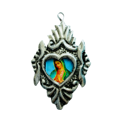 Silver heart-shaped pendant with detailed silver border and central image of the Virgin Mary.