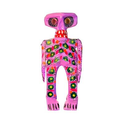 Colorful hand-painted wooden sugar skull skeleton figure. in purple with decorative patterns.