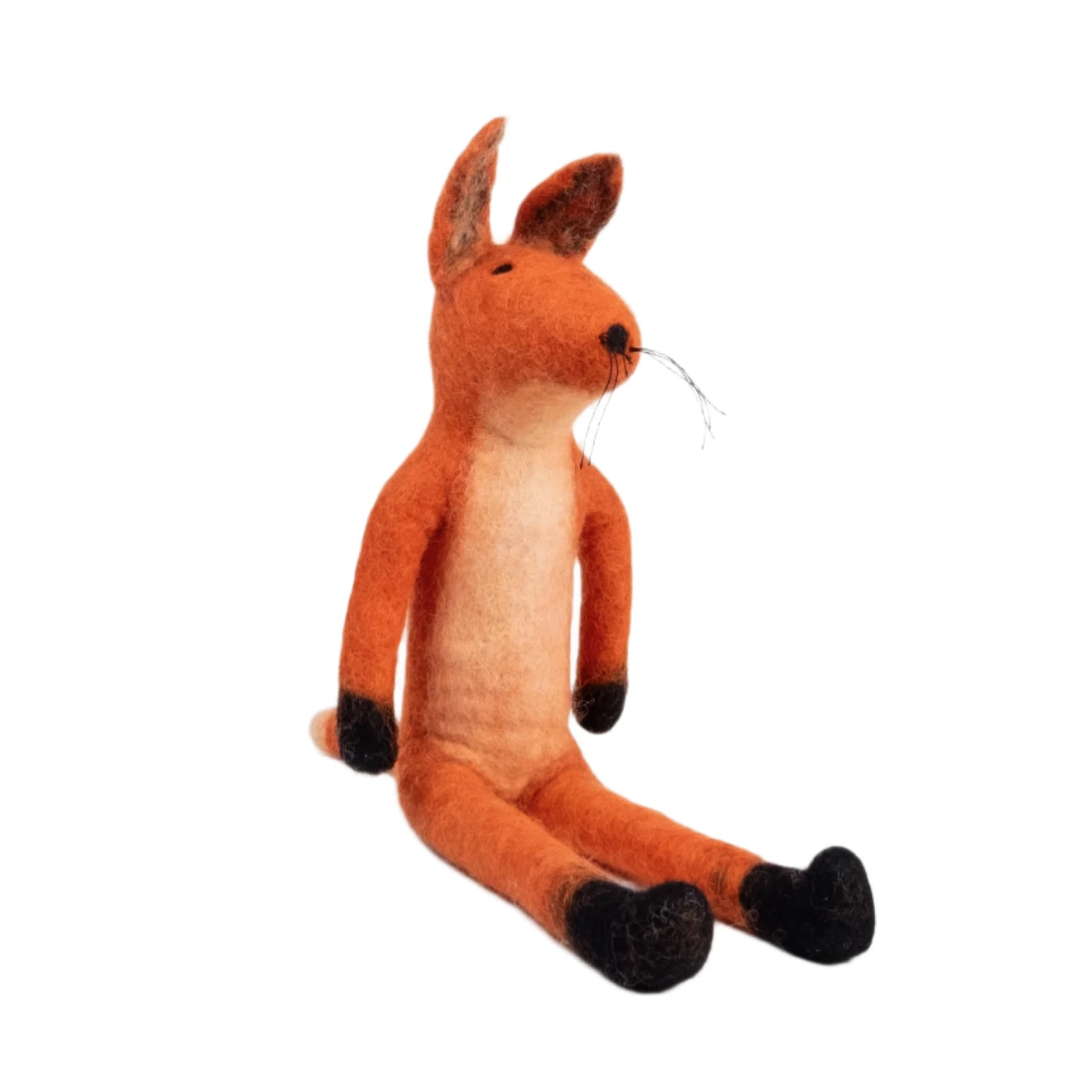 A handcrafted felt fox doll with an orange body, black paws, and a cream-colored belly, sitting against a white background. 