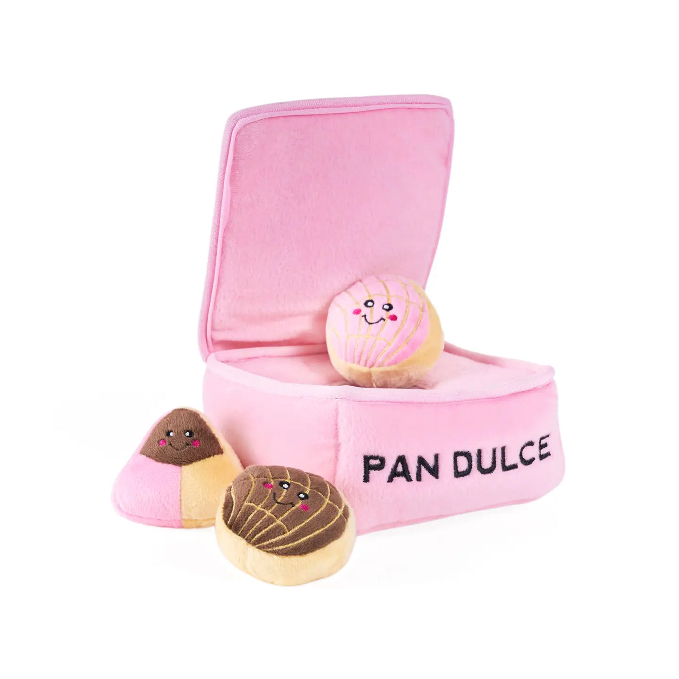 pink plush box dog toy with the phrase Pan Dulce in black featuring 3 small pan dulce shaped toys.