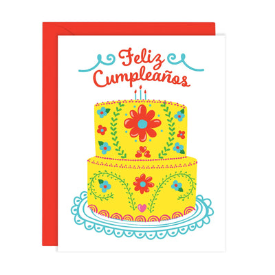 White card that features a yellow, red and teal Mexican Embroidery Cake with the phrase Feliz Cumpleaños in red lettering