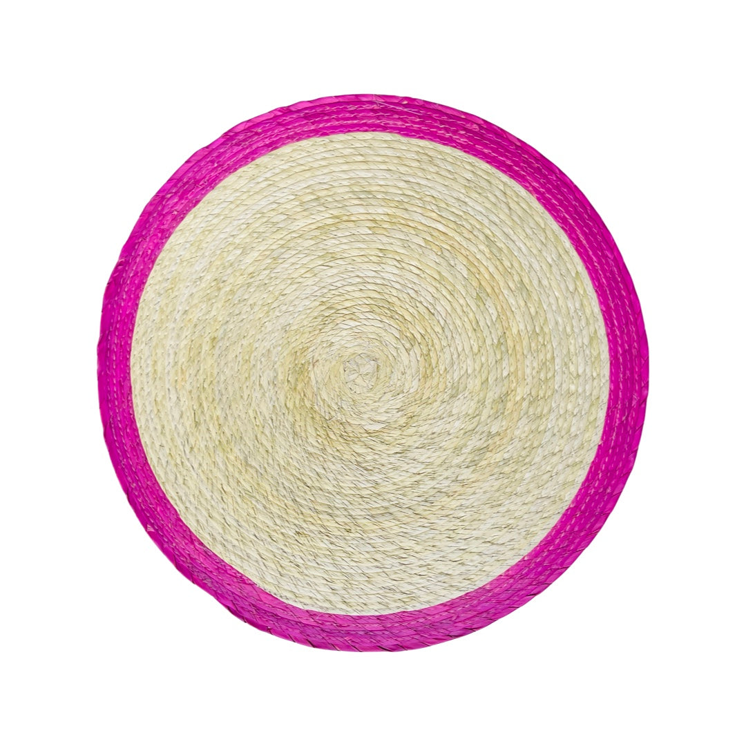 Round natural colored palm placemat with a pink border