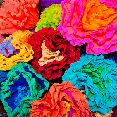 A bundle of multi-colored paper flowers
