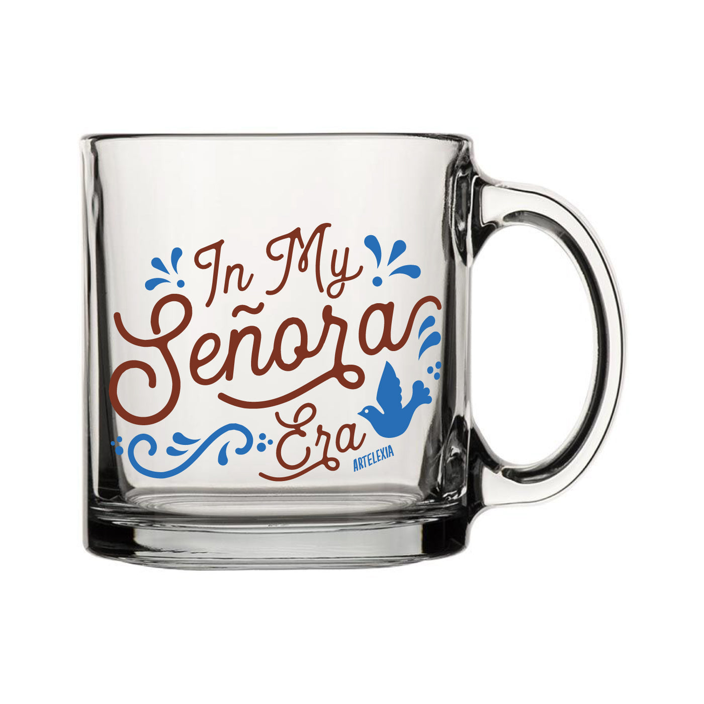 Clear glass mug with the phrase In My Senora Era in brown lettering and blue filagree