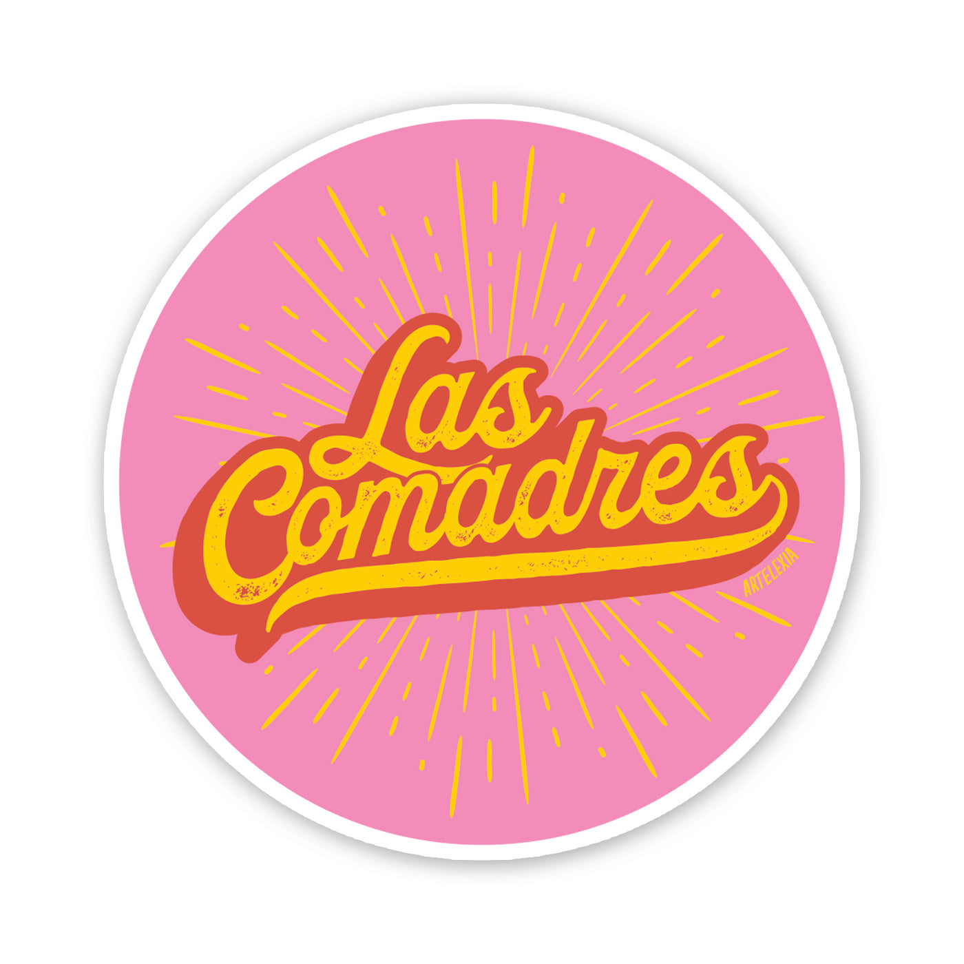 Round pink with the phrase Las Comadres in yellow and red with a yellow burst in the background.