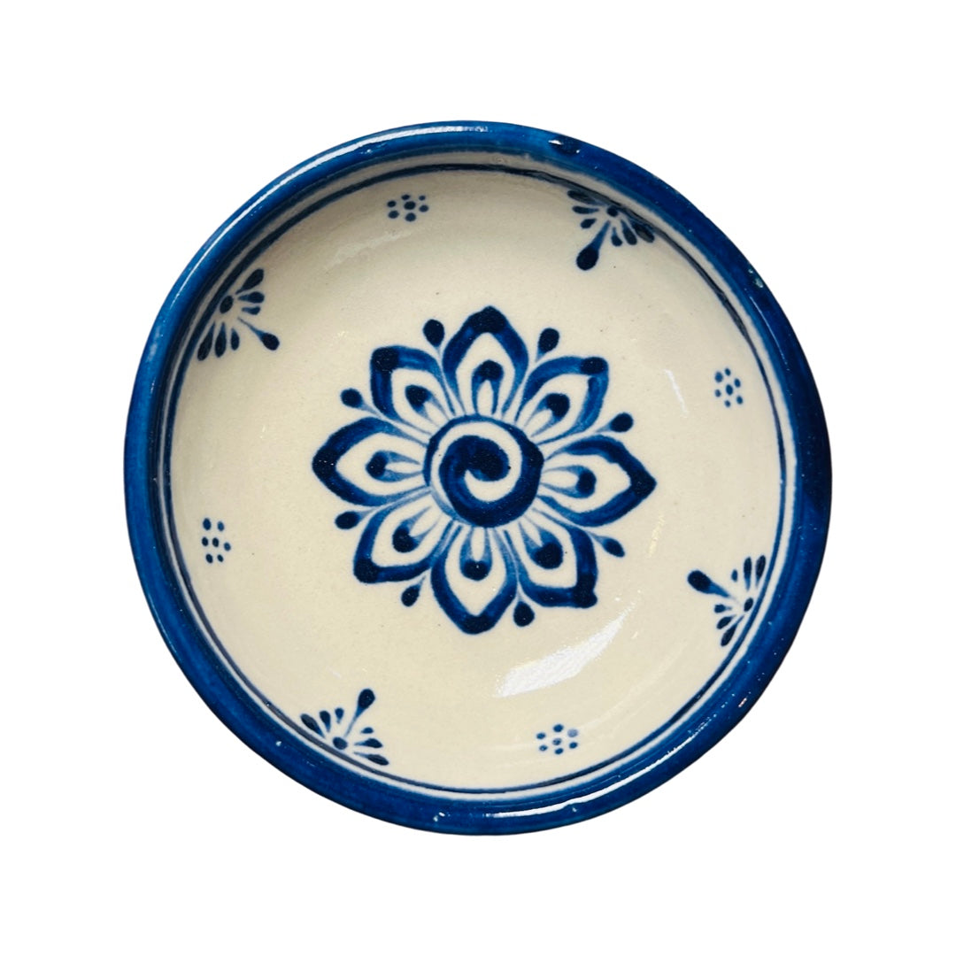 Blue and cream stoneware bowl with an image of a blue flower