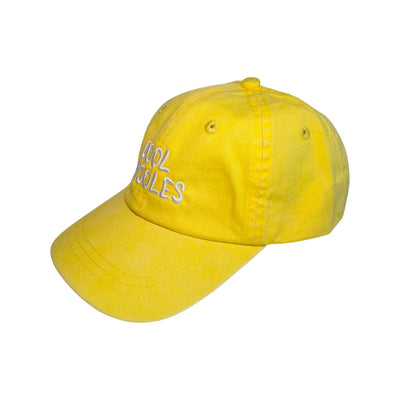Side view of a Yellow kid's hat with the phrase Cool Frijoles in white lettering