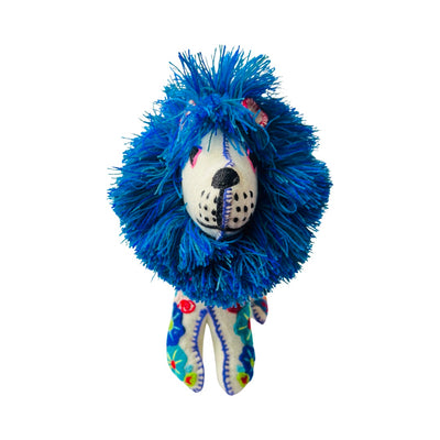 Front view of a white embroidered lion with a blue mane and features colorful flowers.