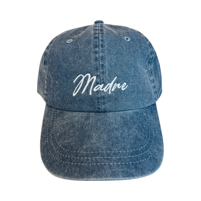 heathered navy blue hat with the word Madre in white lettering