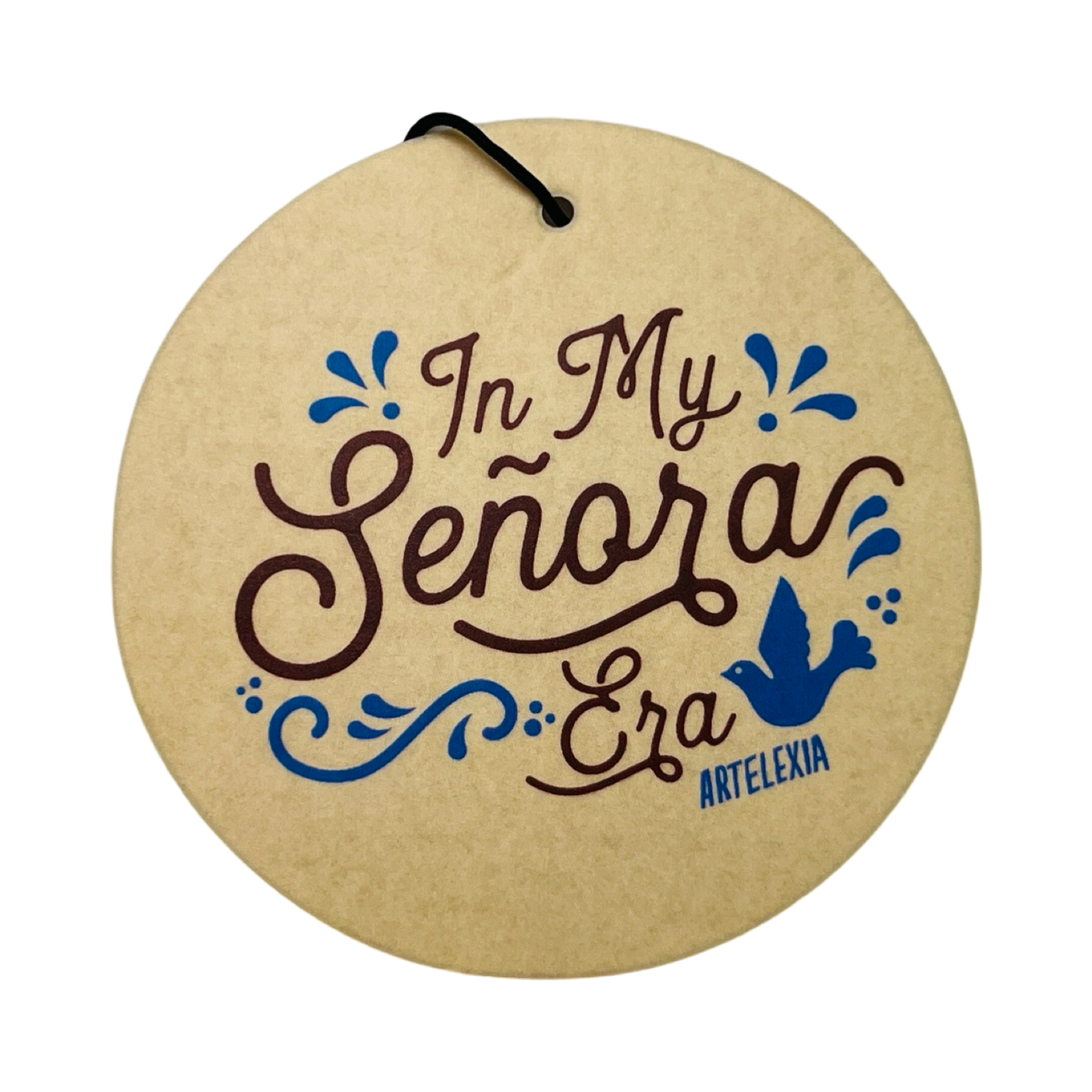 round beige freshener with the phrase In My Señora Era in brown lettering and features blue filagree design with a blue bird.