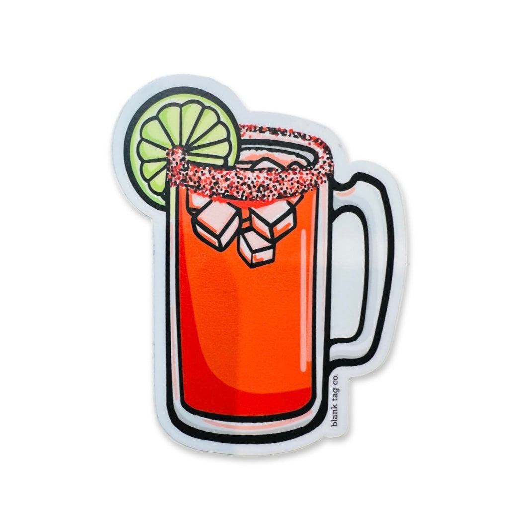 Image of a glass of michelada featuring a sliced of lime and salted rim.