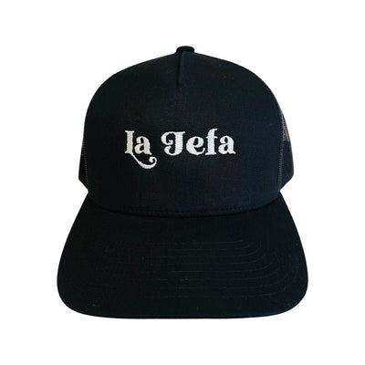 Black mesh snap back hat with the phrase La Jefa in white lettering