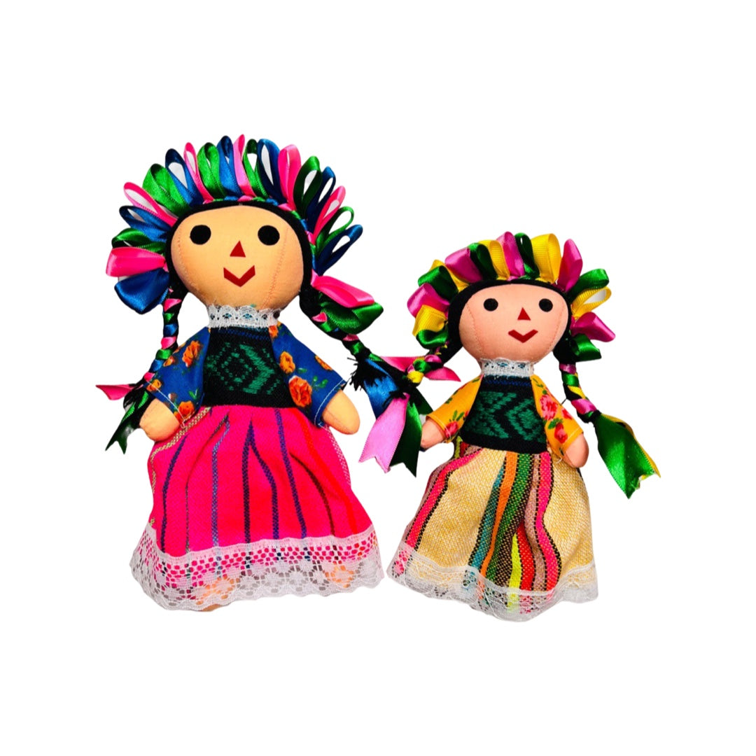 A set of colorful Mexican maria dolls with a pink striped and yellow striped dress and multi-colored ribbon head band.