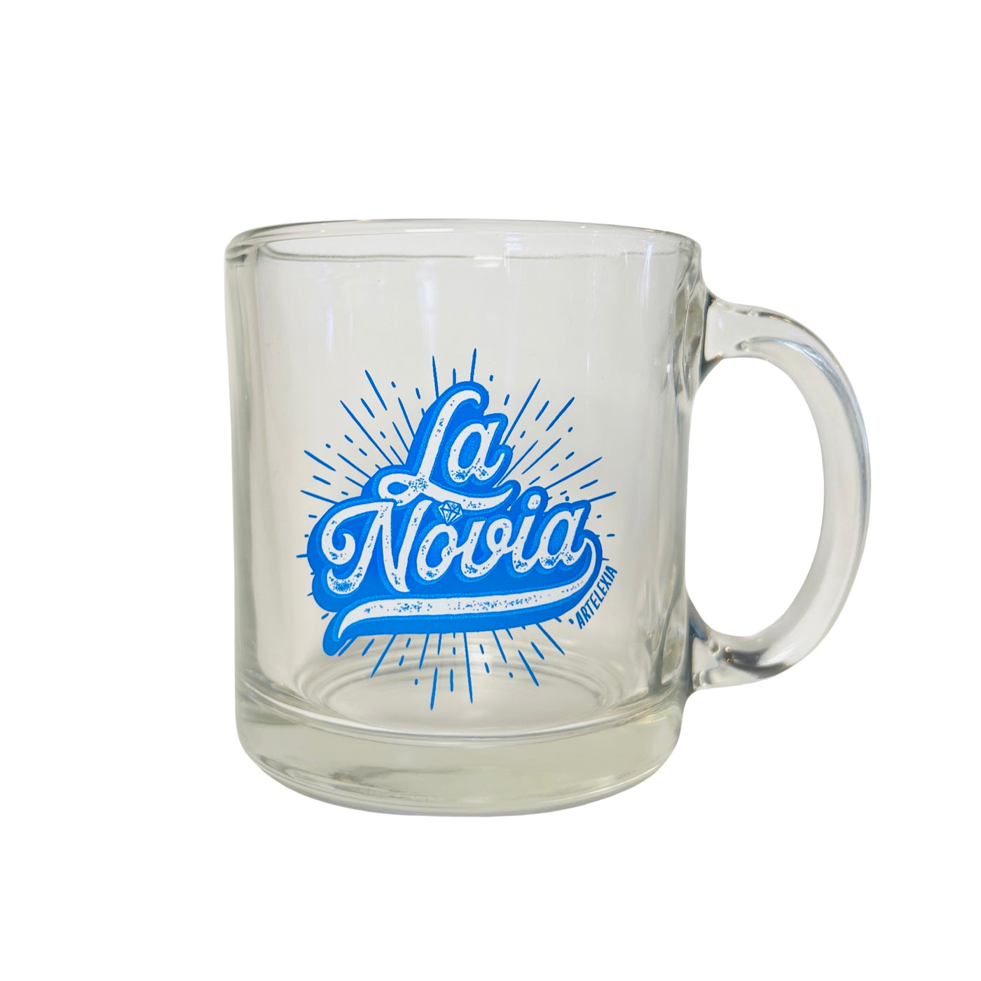 clear glass mug with the phase La Novia in blue lettering