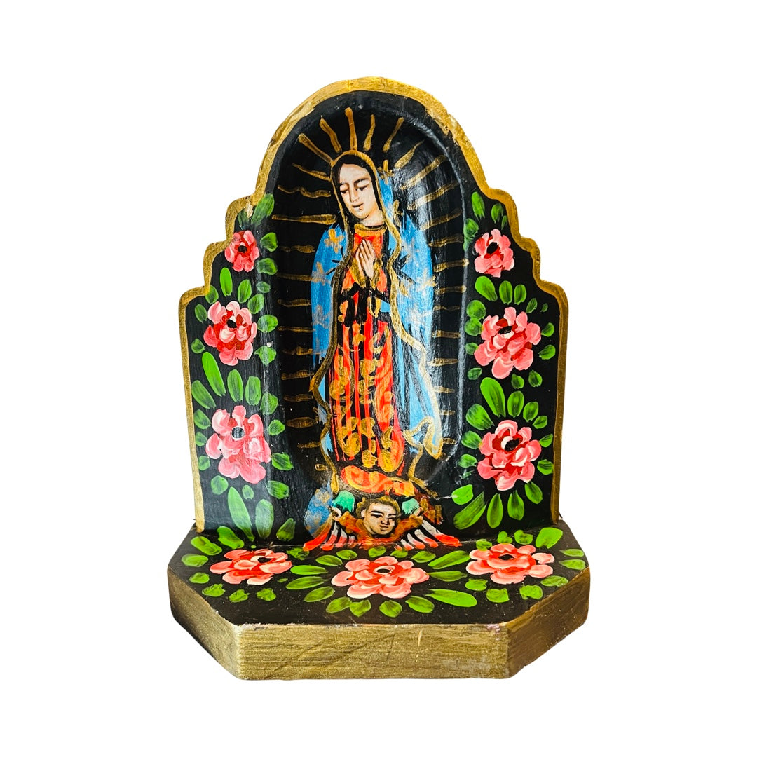 Virgin de Guadalupe wooden altar with an image of the VIrgin Mary featuring a border of flowers