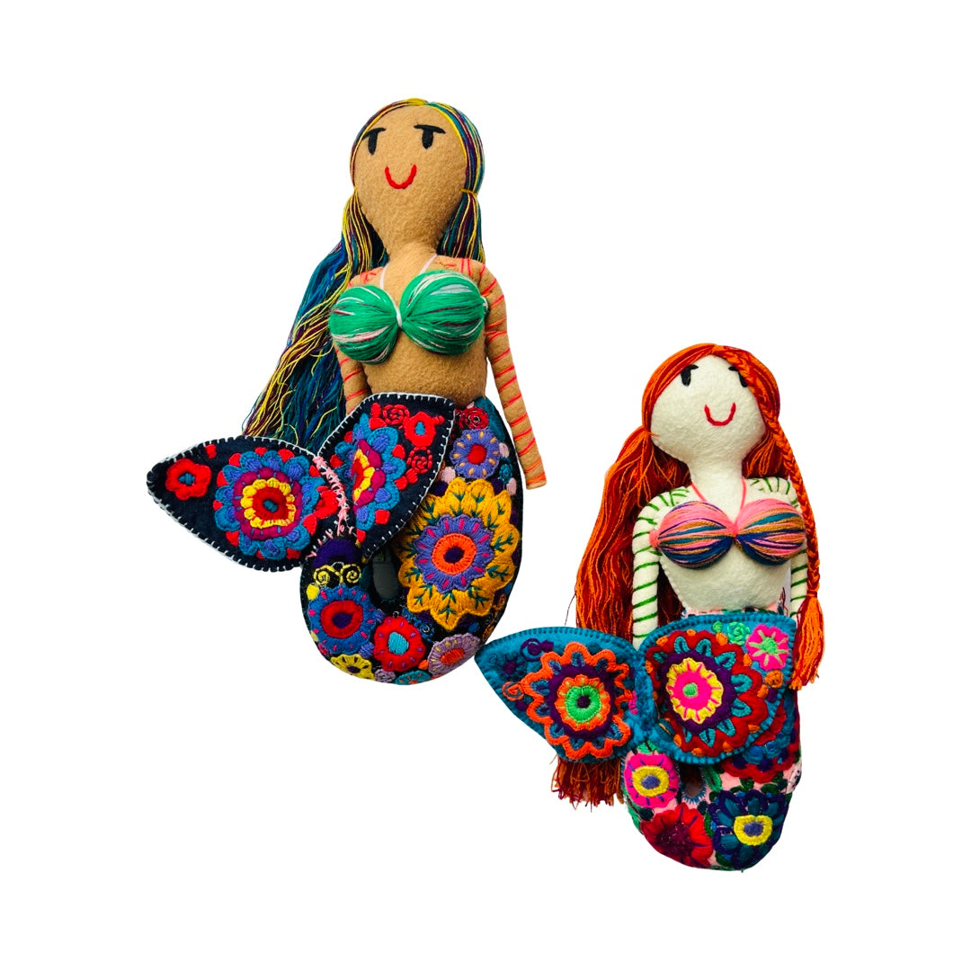 front view of a set of embroidered mermaid dolls that features colorful flowers on their tail.