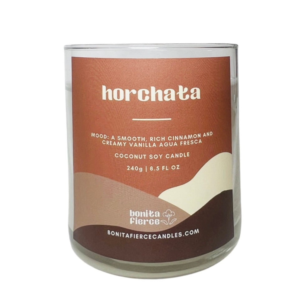 8.5 oz glass candle with branded label in various shades of brown.