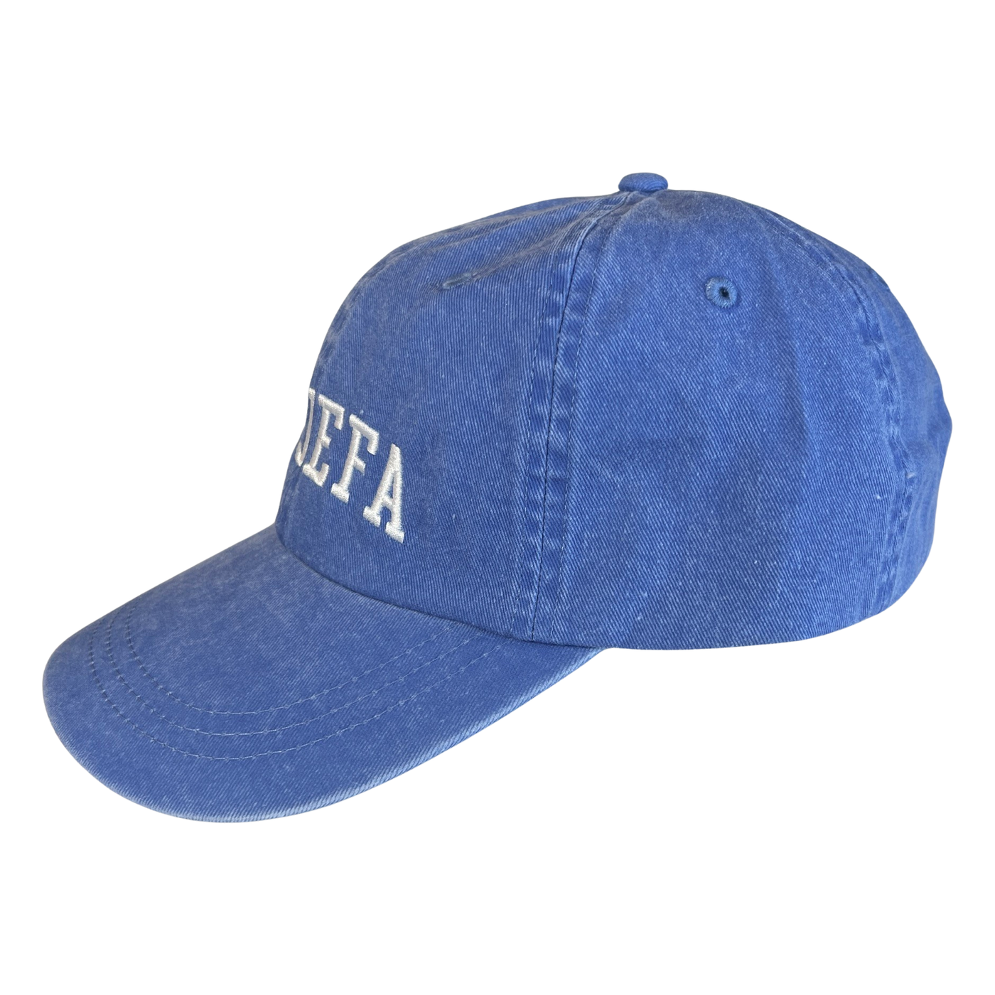 side view of a blue hat with the phrase La Jefa in white lettering